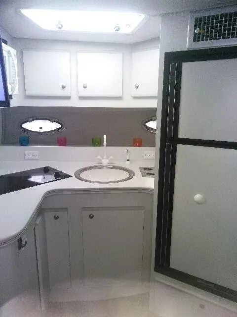 Slide: The Image of Interior of 1994 Cruisers Yachts 3672 Express with TV displaying Disney DVD. - 15