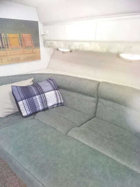 Slide: The Image of Cozy bedroom in 1994 Cruisers Yachts 3672 Express with elegant bedding and pillows. - 16