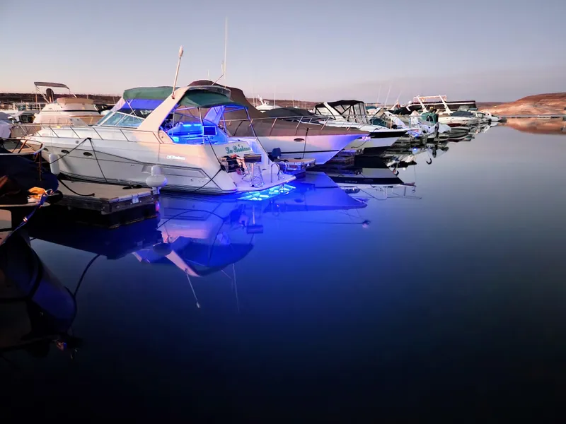 Slide: The Image of Child enjoying water by 1994 Cruisers Yachts 3675 Esprit, docked with chairs on deck. - 21