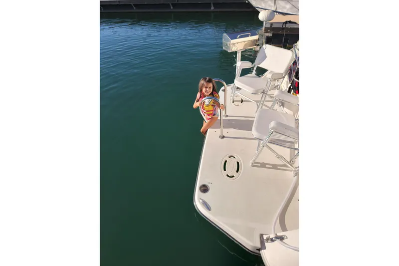 Slide: The Image of 1994 Cruisers Yachts 3675 Esprit interior with sink and mounted TV screen. - 23