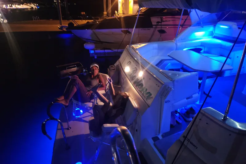 Slide: The Image of 1994 Cruisers Yachts 3675 Esprit anchored on sandy beach with other boats nearby. - 27