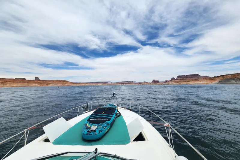 Slide: The Image of White leather seating on 1994 Cruisers Yachts 3675 Esprit with teal accent stripe. - 30