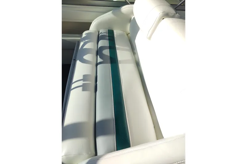 Slide: The Image of 1994 Cruisers Yachts 3675 Esprit interior with marina view, featuring seating and table. - 32