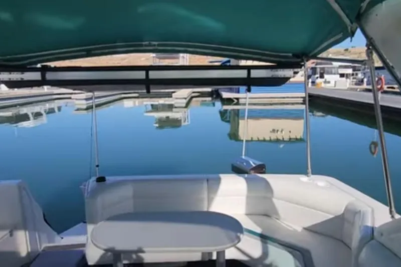 Slide: The Image of 1994 Cruisers Yachts 3675 Esprit docked at a marina under clear blue skies. - 34