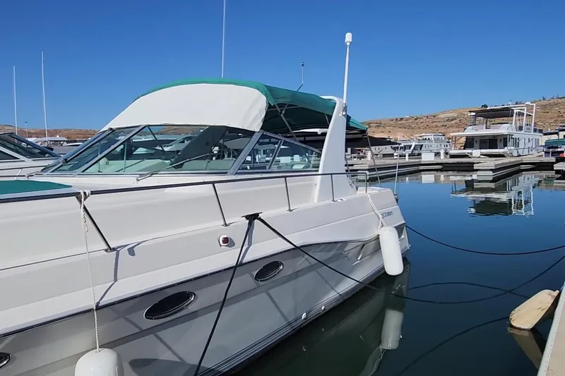 Slide: The Image of 1994 Cruisers Yachts 3675 Esprit kitchen with stove, sink, and pull-out cutting board. - 36