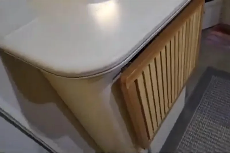 Slide: The Image of 1994 Cruisers Yachts 3675 Esprit docked at marina, with scenic water and sky view. - 37