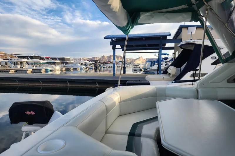 Slide: The Image of 1994 Cruisers Yachts 3675 Esprit docked at marina with canopy and seating. - 39