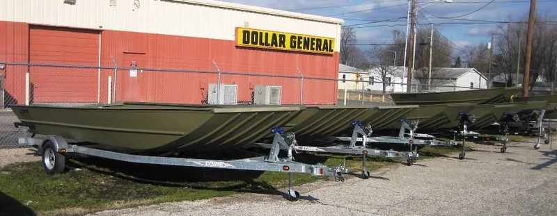Slide: The Image of Lowe L1448T Jon boats outside Dollar General, 2025 model. - 3