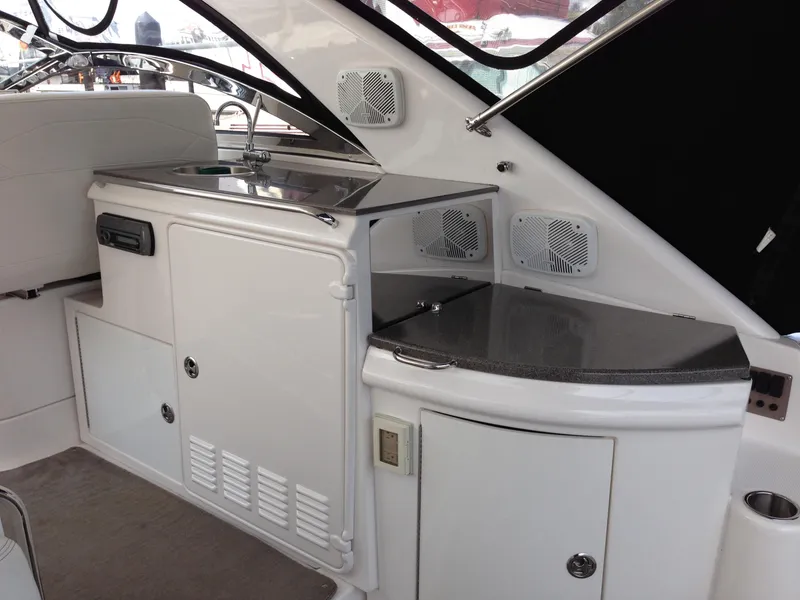 Slide: The Image of 2008 Regal Commodore 4460 yacht interior with kitchenette and sink. - 12