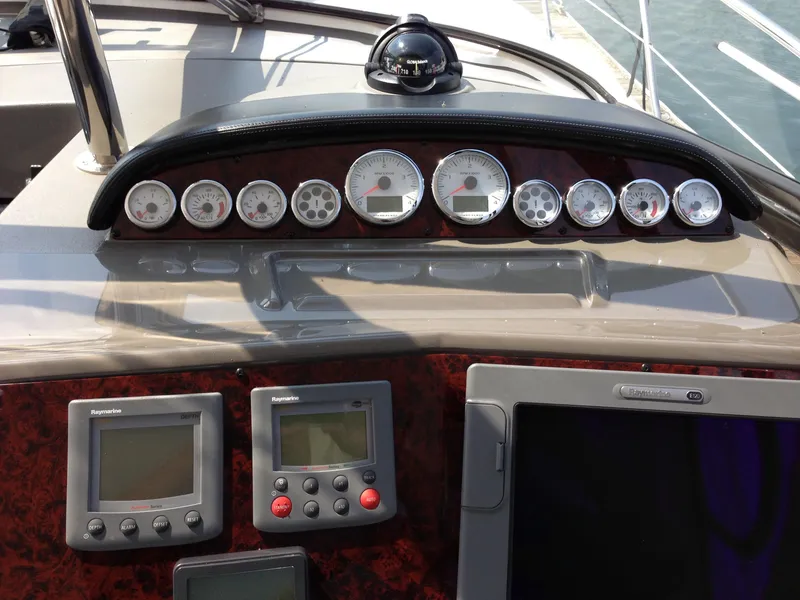 Slide: The Image of Dashboard of 2008 Regal Commodore 4460 with gauges and navigation equipment. - 18