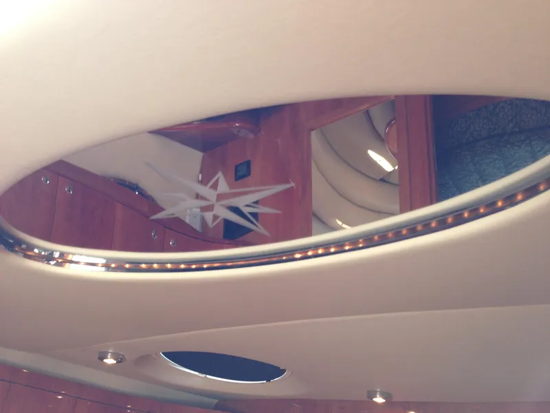 Slide: The Image of Interior view of 2008 Regal Commodore 4460 yacht with elegant wood finish. - 20