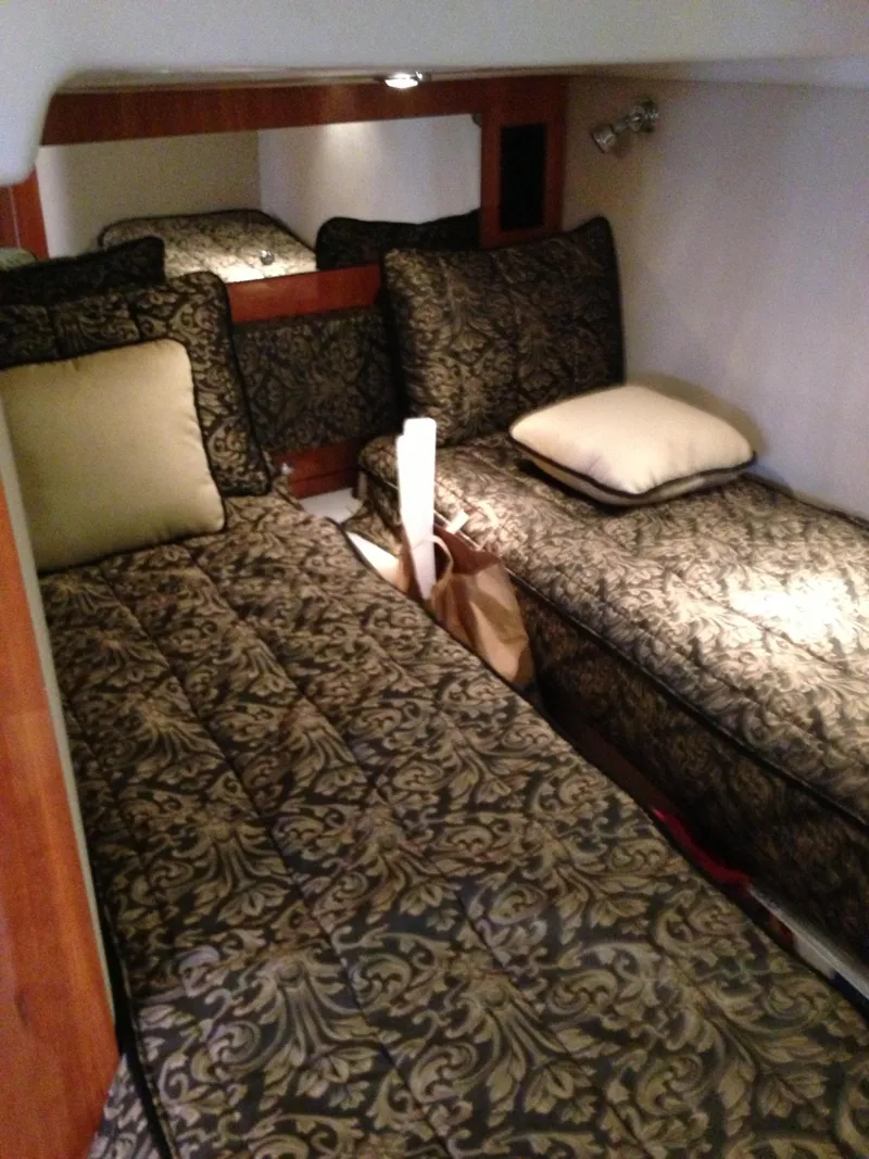 Slide: The Image of 2008 Regal Commodore 4460 cabin with patterned bedding and twin beds. - 33