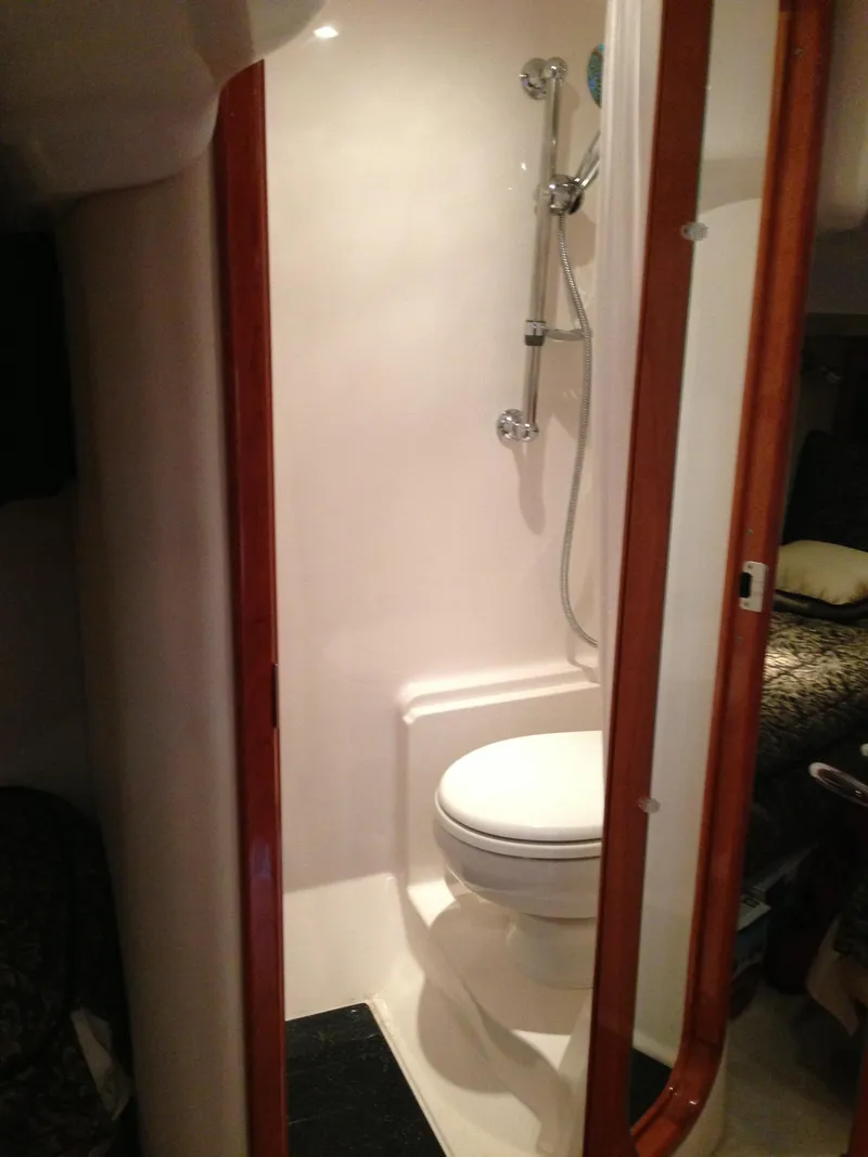 Slide: The Image of 2008 Regal Commodore 4460 yacht bathroom with shower and toilet. - 37