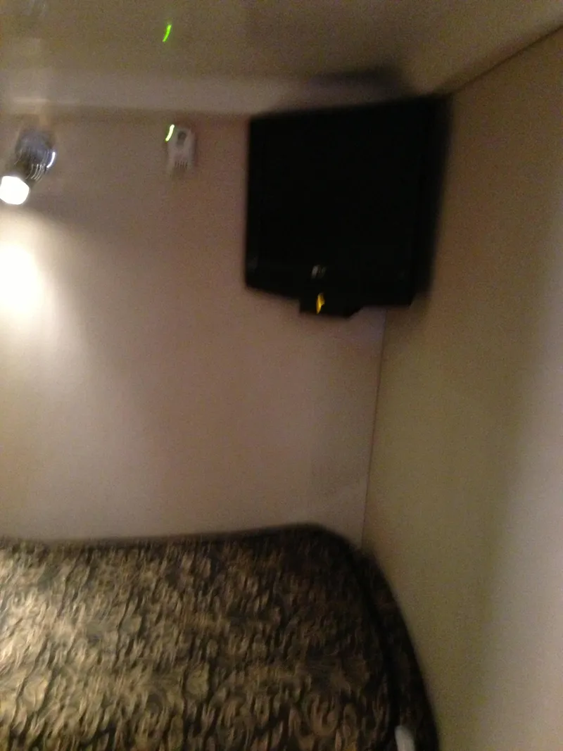 Slide: The Image of Interior of 2008 Regal Commodore 4460 with bed and wall-mounted TV. - 38