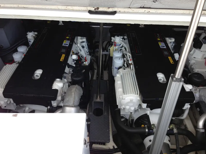 Slide: The Image of Engine compartment of a 2008 Regal Commodore 4460 boat, showcasing dual engines. - 44