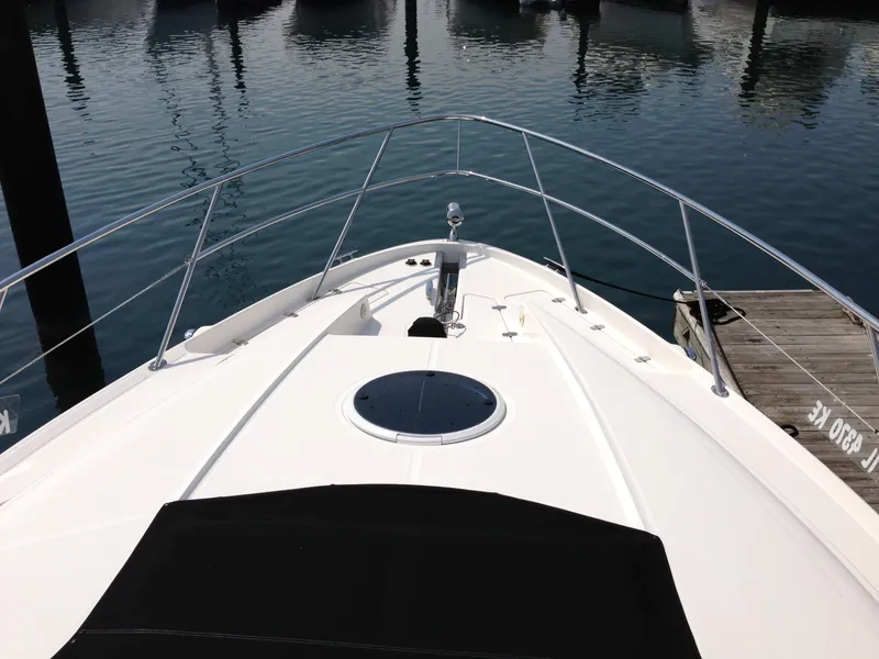 Slide: The Image of 2008 Regal Commodore 4460 yacht bow view at marina dock. - 5