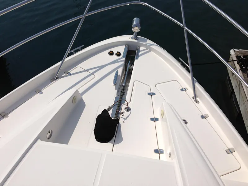 Slide: The Image of Bow of 2008 Regal Commodore 4460 yacht with anchor and railing. - 6