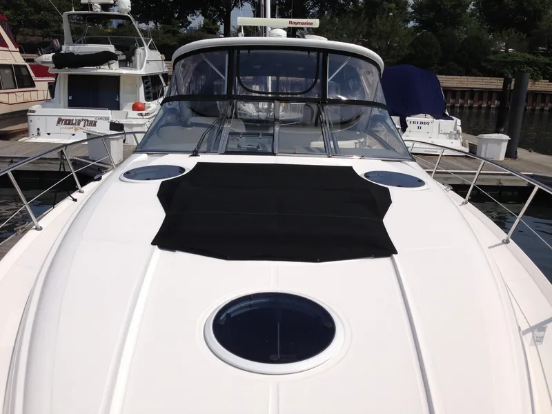 Slide: The Image of 2008 Regal Commodore 4460 yacht docked, featuring sleek design and spacious deck. - 7