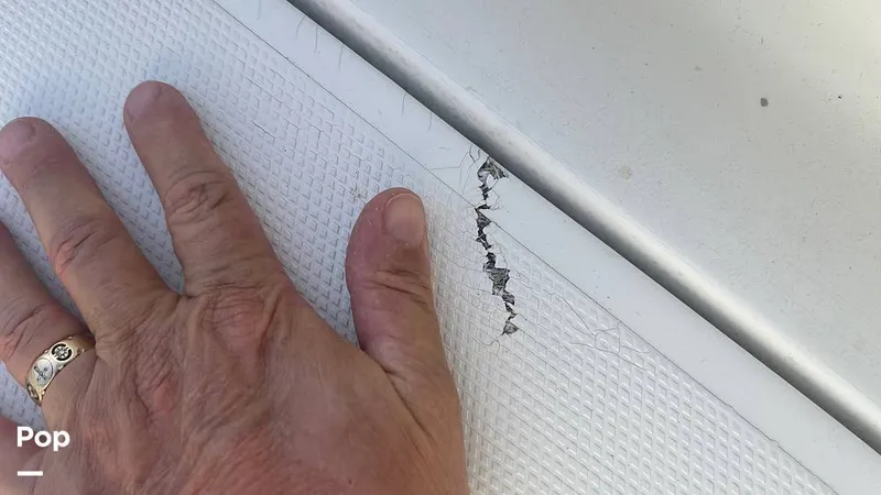 Slide: The Image of Smal Crack In Forward Deck Hatch, Under Cushion - 15315651