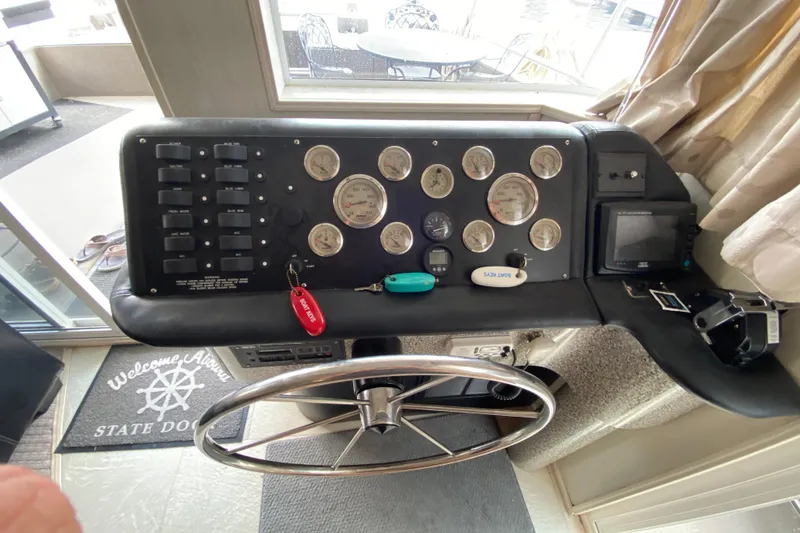 Slide: The Image of Control panel of a 2000 Navigator Showboat with gauges and steering wheel. - 4