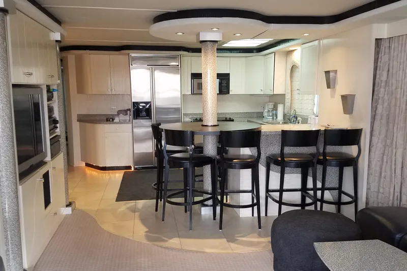 Slide: The Image of Luxurious 2000 Navigator Showboat kitchen with modern appliances and bar seating. - 7