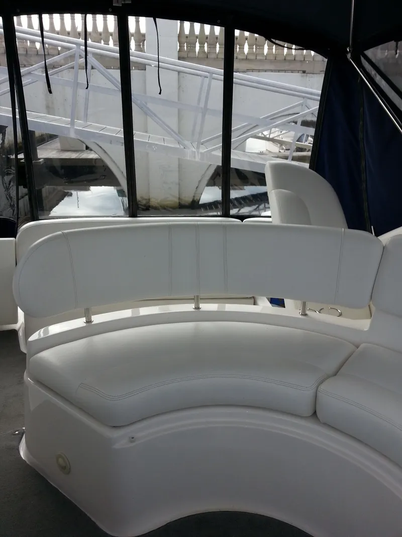 Slide: The Image of Interior of 2007 Regal Commodore 4060 yacht with white seating. - 20