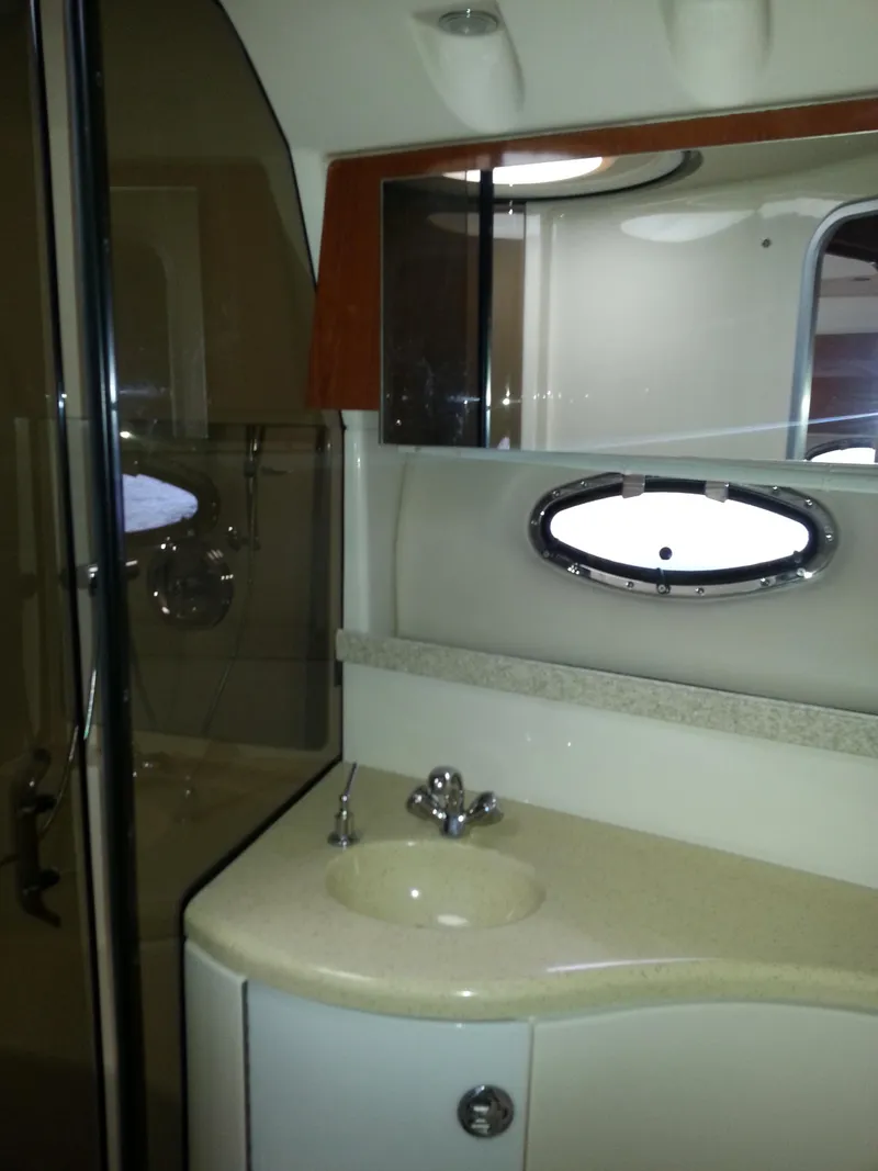 Slide: The Image of 2007 Regal Commodore 4060 yacht bathroom with sink, mirror, and shower. - 27