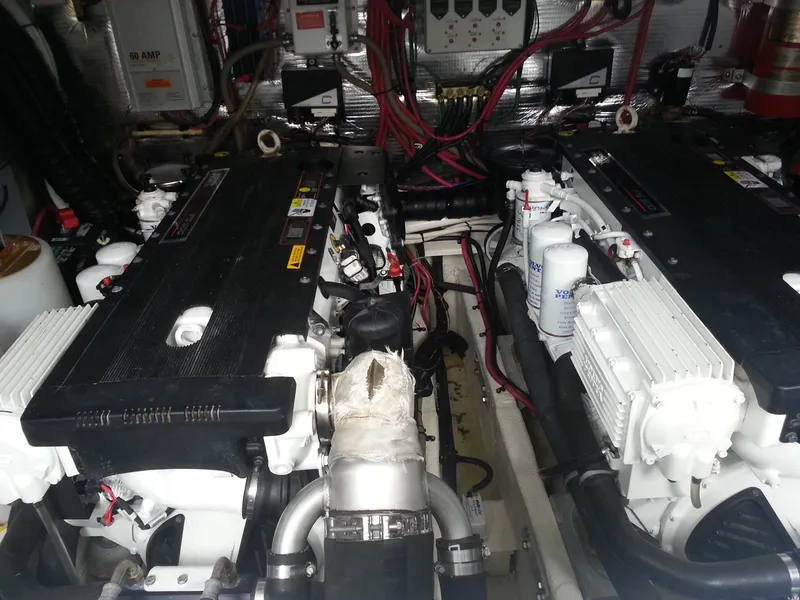 Slide: The Image of Engine room of a 2007 Regal Commodore 4060 boat, featuring dual engines and wiring. - 3