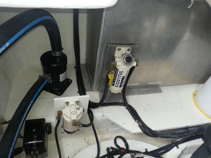 Slide: The Image of Engine compartment of 2007 Regal Commodore 4060 with visible hoses and components. - 5