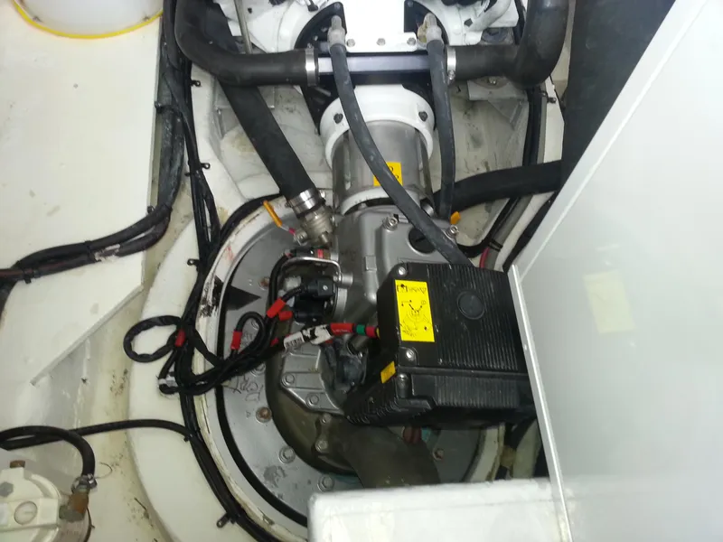 Slide: The Image of Engine compartment of a 2007 Regal Commodore 4060 boat, showing mechanical components and wiring. - 6