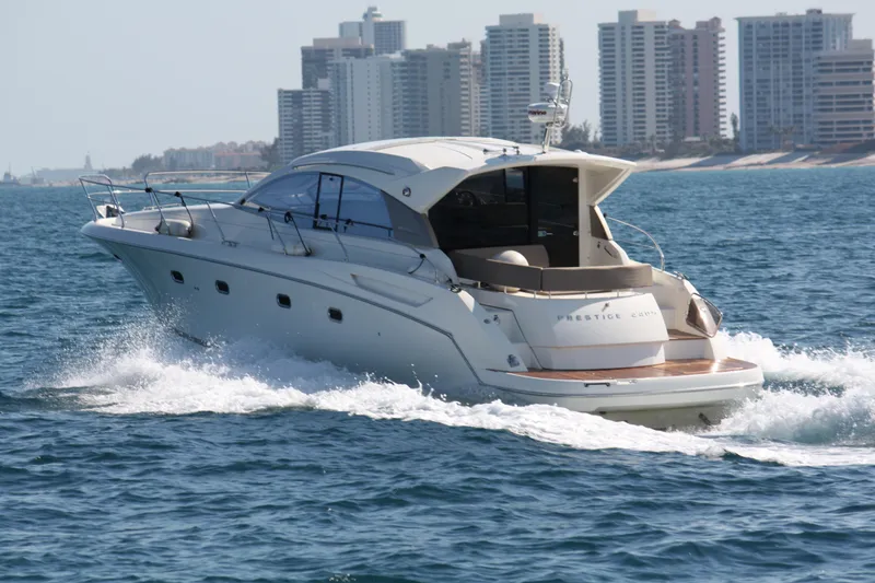 Slide: The Image of Luxury 2012 Prestige 440S yacht cruising near city skyline. - 15