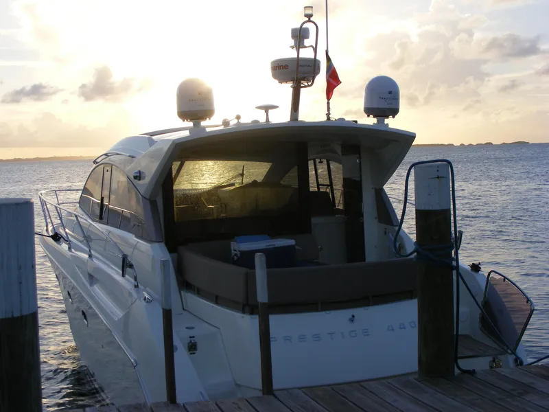 Slide: The Image of Luxury 2012 Prestige 440S yacht docked at sunset, rear view. - 16