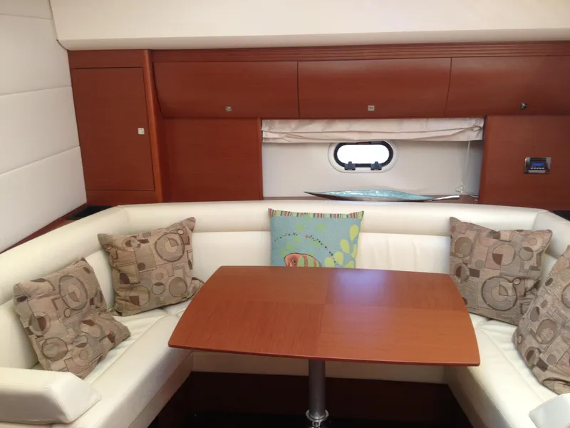 Slide: The Image of Luxurious interior of 2012 Prestige 440S yacht with elegant seating and wooden table. - 25