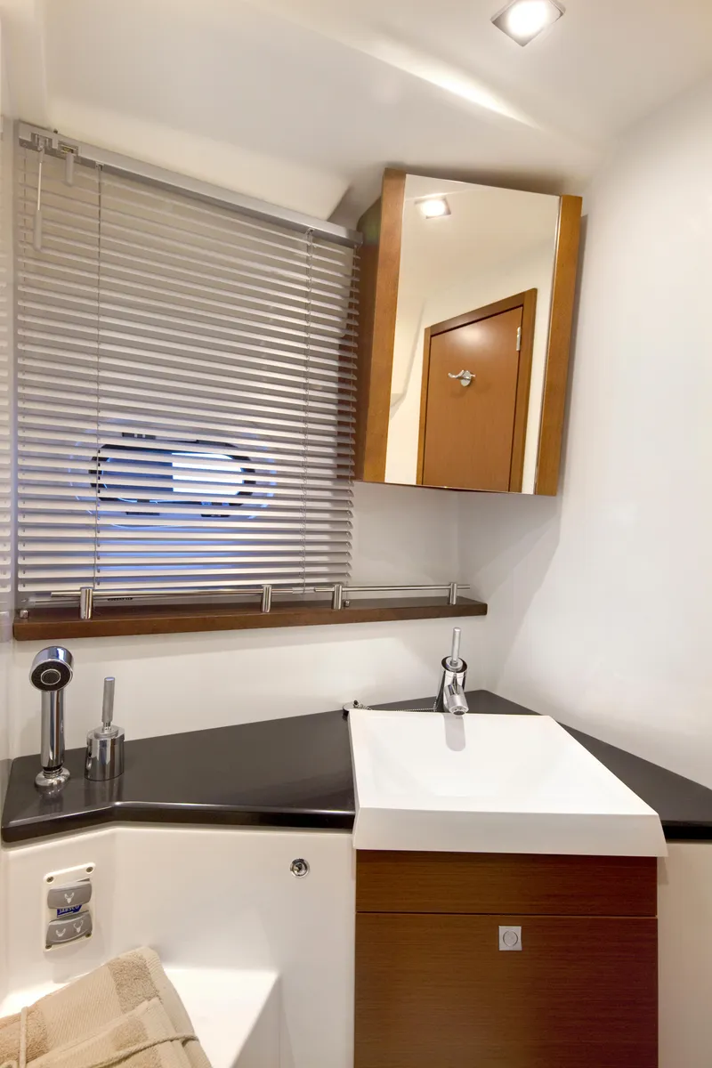 Slide: The Image of Modern bathroom interior in 2012 Prestige 440S yacht with sleek fixtures and blinds. - 28