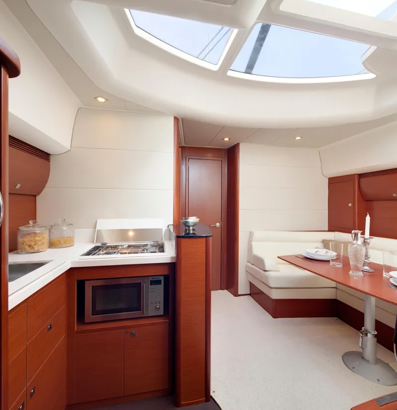Slide: The Image of Luxurious interior of 2012 Prestige 440S yacht with modern kitchen and dining area. - 30