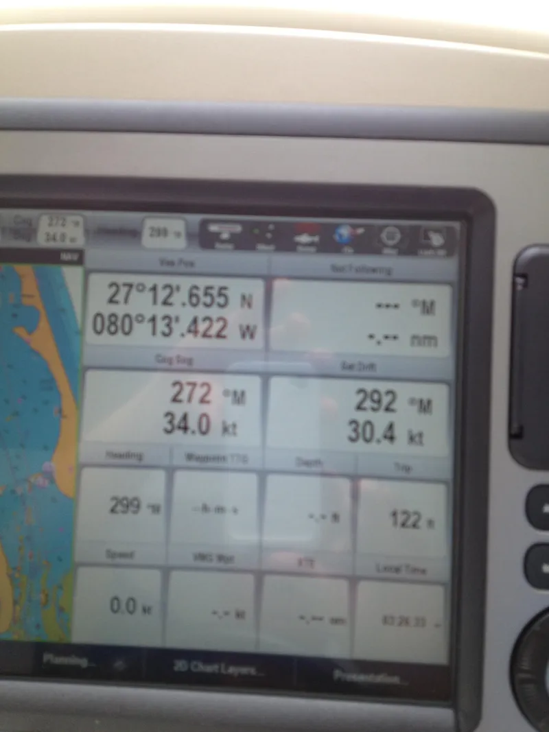 Slide: The Image of Boat navigation system display on a 2012 Prestige 440S, showing coordinates and speed data. - 34