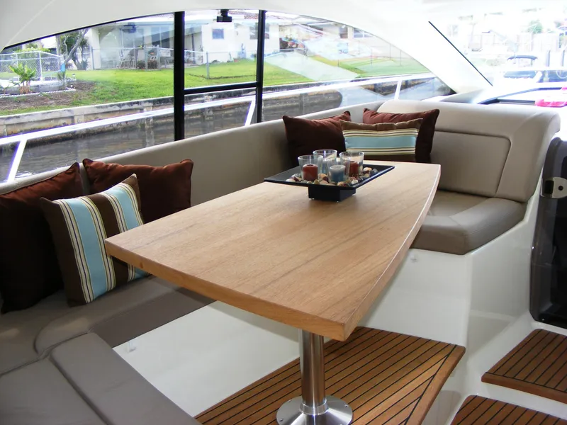 Slide: The Image of Luxurious interior of 2012 Prestige 440S yacht with elegant seating and wooden table. - 36