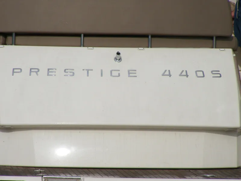 Slide: The Image of 2012 Prestige 440S yacht nameplate on white surface. - 38