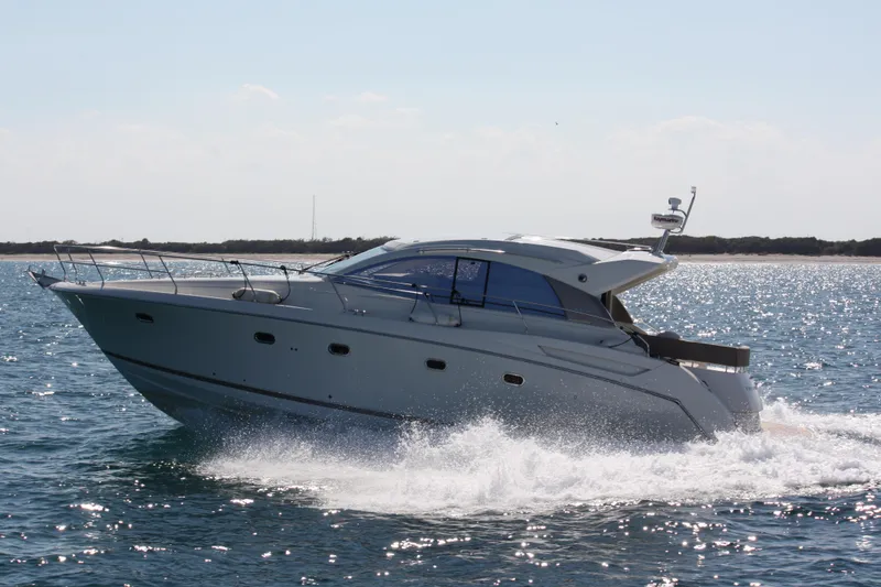 Slide: The Image of Luxury 2012 Prestige 440S yacht cruising on open water. - 4