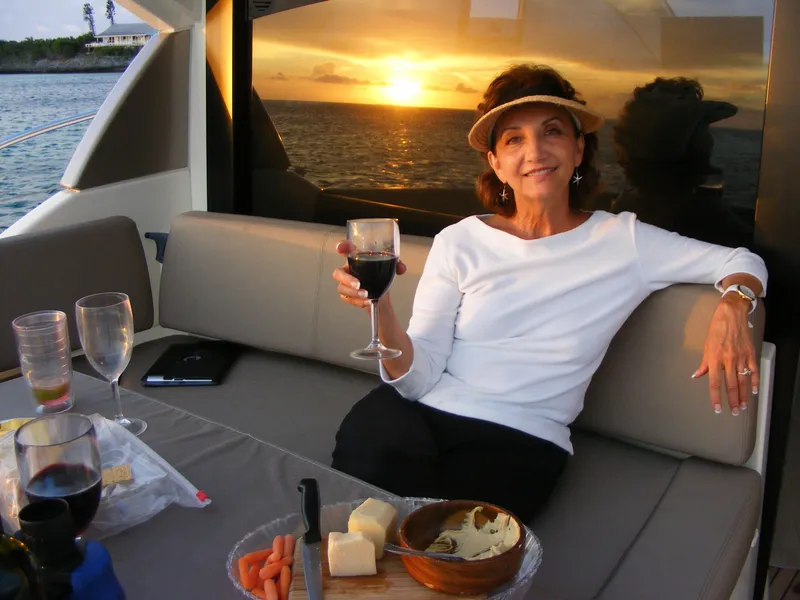 Slide: The Image of Woman enjoying wine and snacks on a 2012 Prestige 440S yacht at sunset. - 41