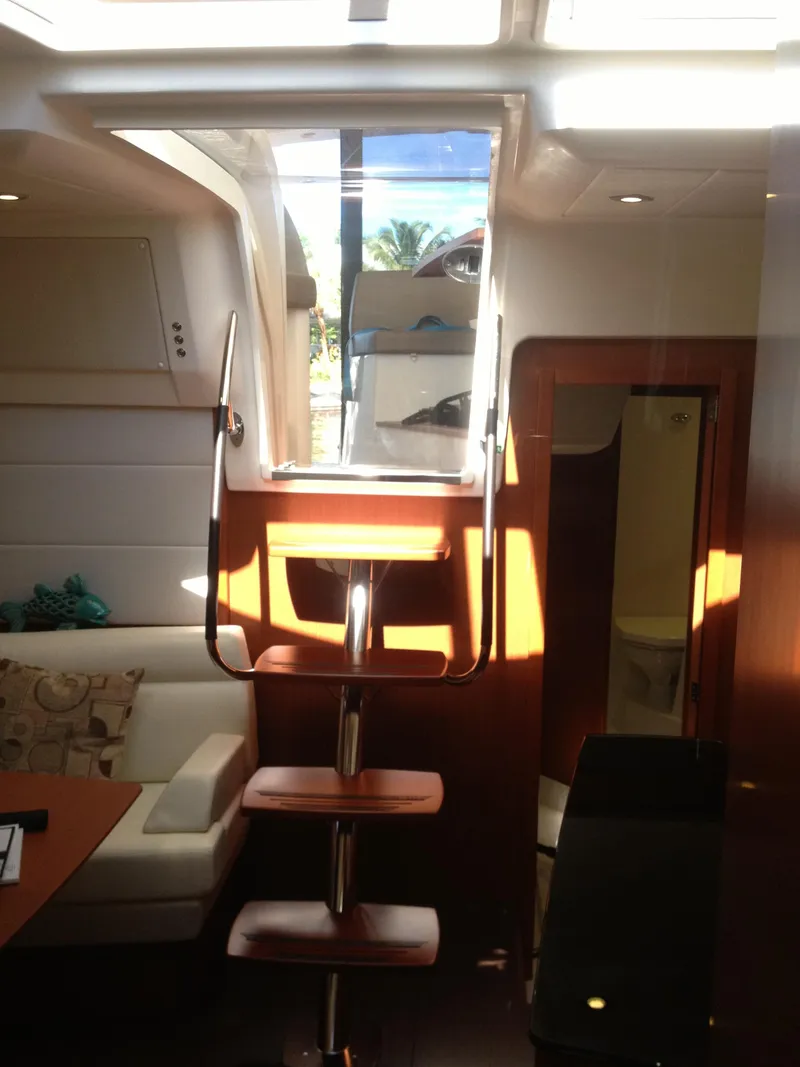 Slide: The Image of Interior of 2012 Prestige 440S yacht with wooden stairs and modern seating area. - 42