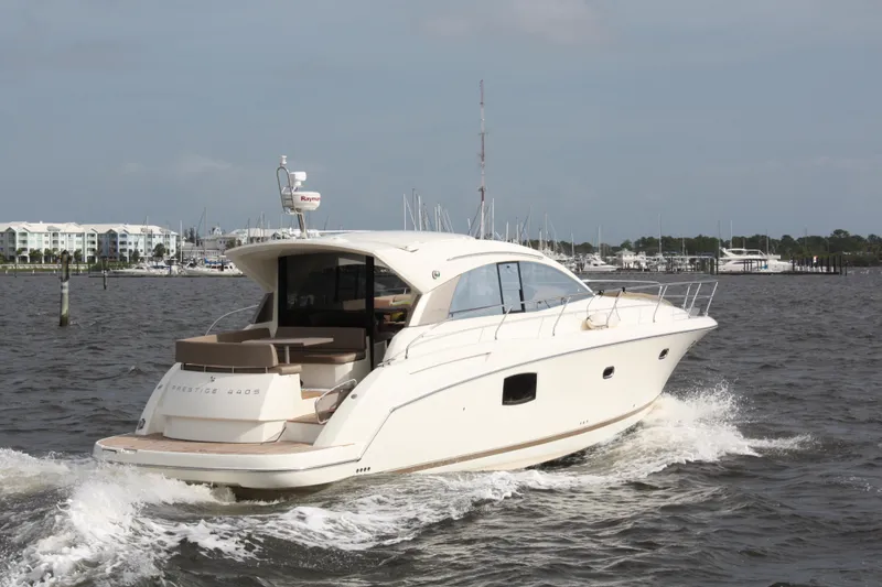 Slide: The Image of Luxury 2012 Prestige 440S yacht cruising on open water. - 7