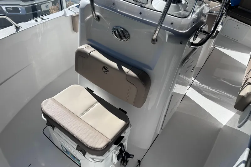 Slide: The Image of 2026 Edgewater 188CC boat interior with cushioned seating and console. - 13
