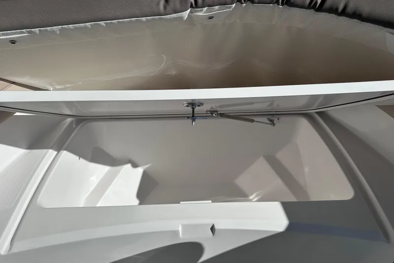 Slide: The Image of Open storage compartment in 2026 Edgewater 188CC boat, showcasing interior space and design. - 14
