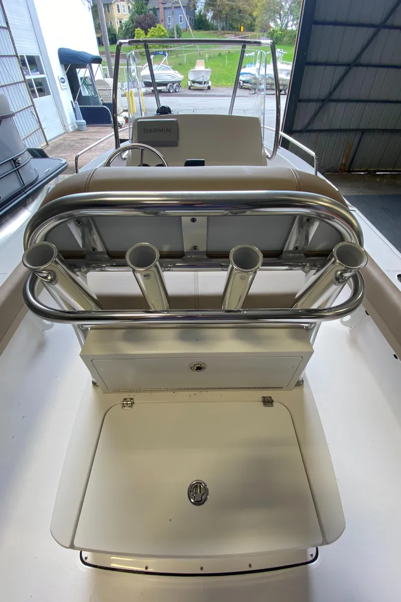 Slide: The Image of 2026 Edgewater 188CC boat with powerful outboard motor in showroom display. - 2