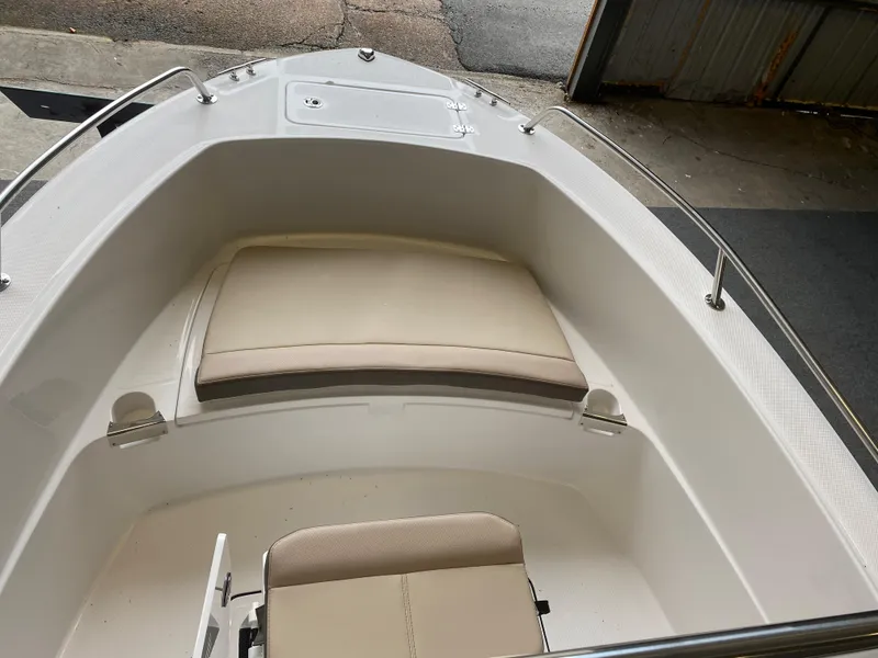 Slide: The Image of 2026 Edgewater 188CC boat interior with seating and American flag display. - 4