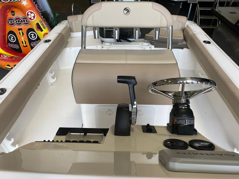 Slide: The Image of 2026 Edgewater 188CC boat interior with storage compartment and stainless steel railing. - 5