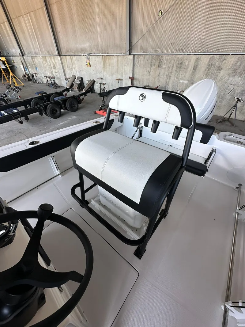 Slide: The Image of 2025 Edgewater 208CC Center Console boat interior under a canopy. - 12