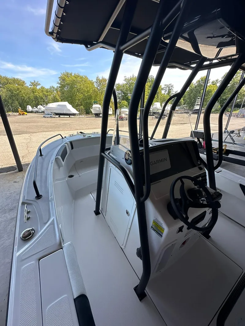 Slide: The Image of 2025 Edgewater 208CC Center Console boat interior with Garmin navigation system. - 13