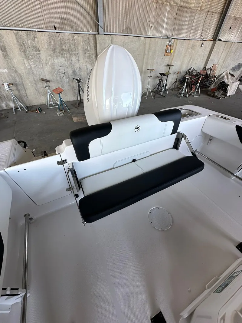 Slide: The Image of 2025 Edgewater 208CC Center Console boat, sleek design, spacious deck, modern features. - 8